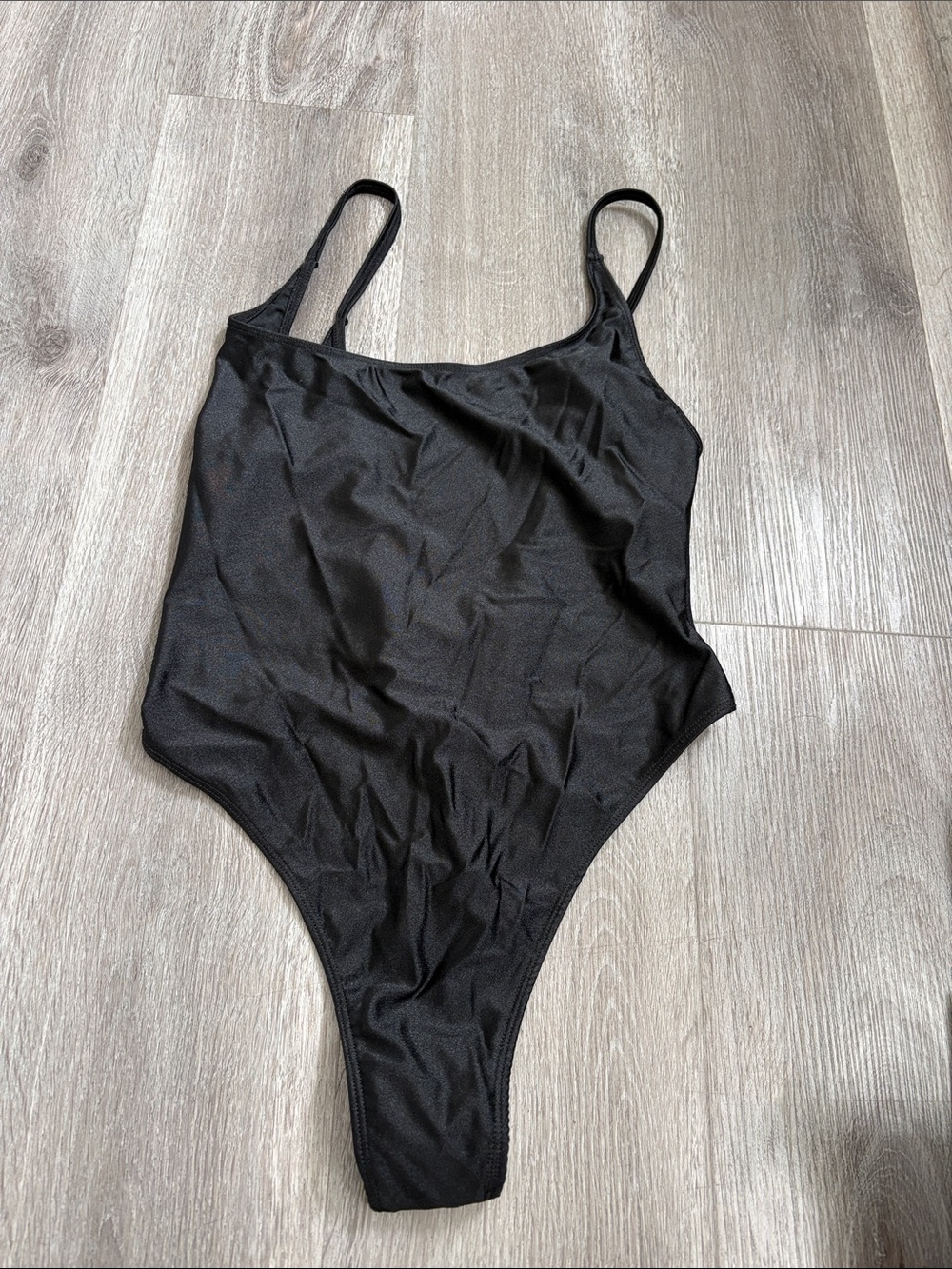 Sleek Black One-Piece Swimsuit with Thin Straps